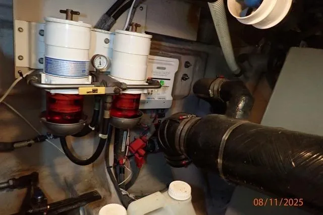 Slide: The Image of Engine room of 2003 Sea Ray Sundancer 460 with fuel filters and piping system. - 43