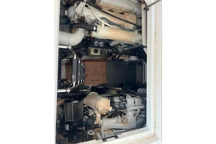Slide: The Image of Engine compartment of a 2003 Sea Ray Sundancer 460 yacht, showcasing mechanical components. - 45