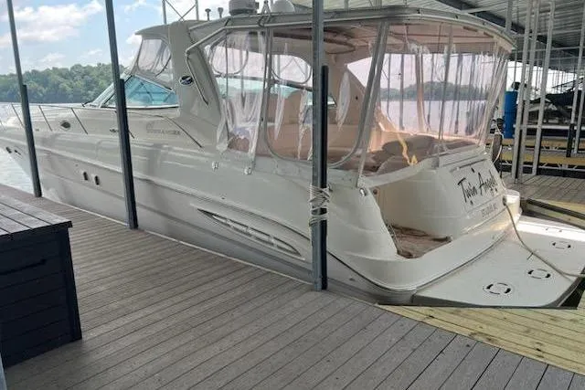Slide: The Image of 2003 Sea Ray Sundancer 460 docked under a covered marina. - 5