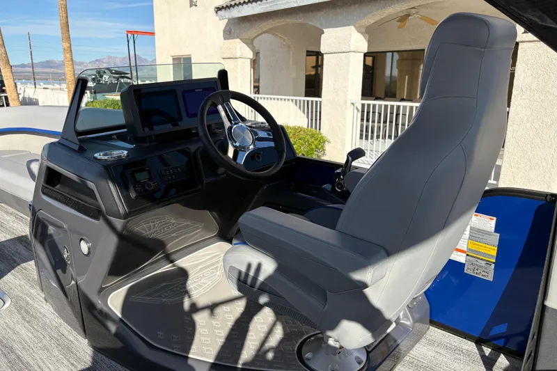 Slide: The Image of 2026 Bennington 26 MCSB boat cockpit with modern steering and controls. - 11