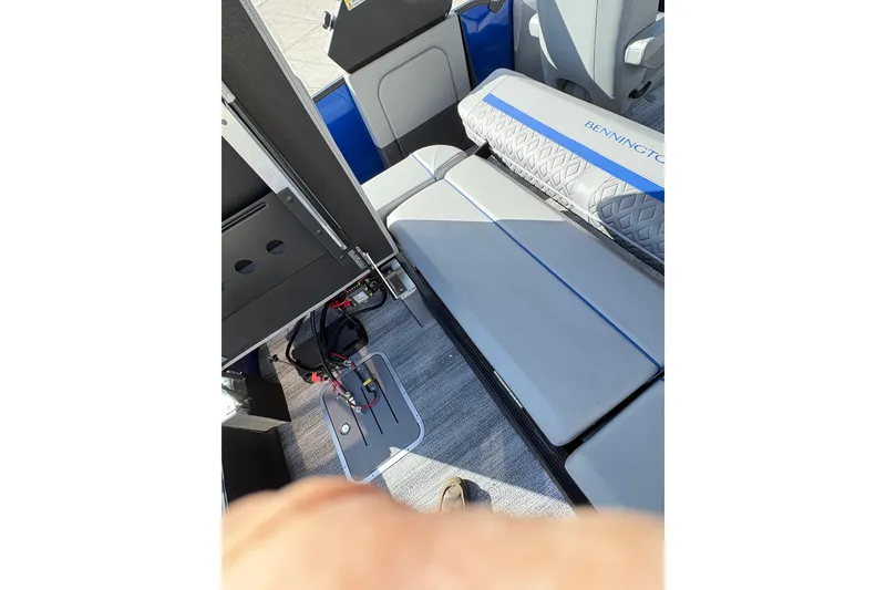 Slide: The Image of 2026 Bennington 26 MCSB boat interior with seating and storage compartments. - 16