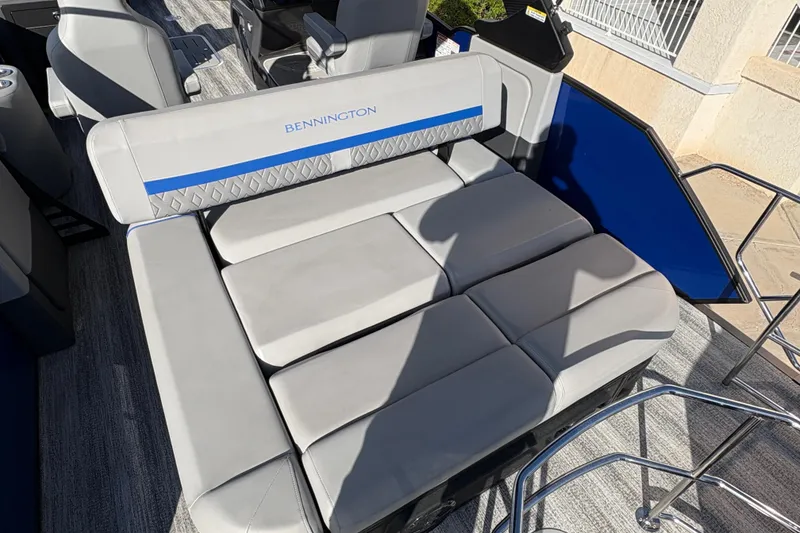 Slide: The Image of 2026 Bennington 26 MCSB boat interior with cushioned seating and modern design. - 19