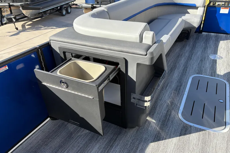 Slide: The Image of 2026 Bennington 26 MCSB boat interior with seating and storage compartment. - 23