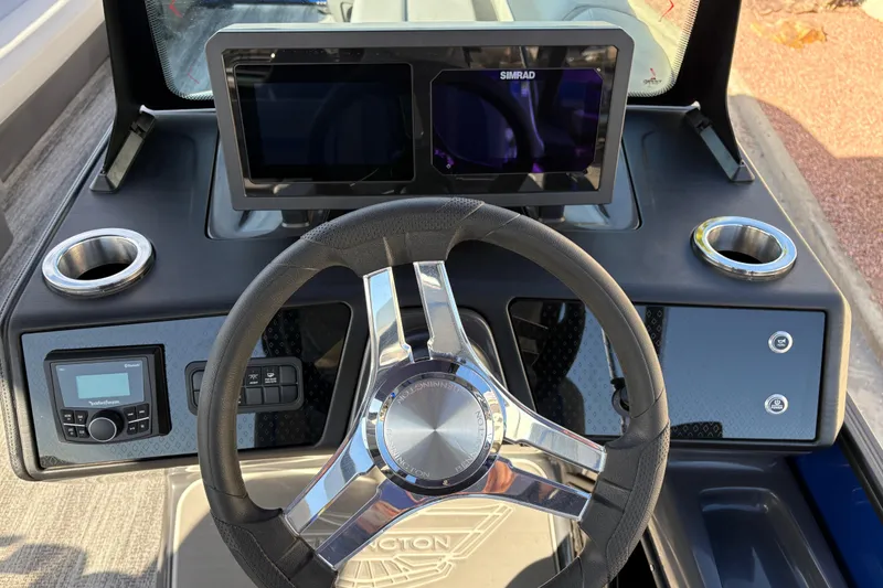 Slide: The Image of Steering console of 2026 Bennington 26 MCSB boat with modern controls and displays. - 24