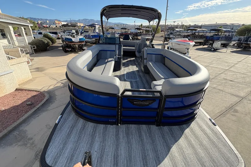 Slide: The Image of 2026 Bennington 26 MCSB pontoon boat with spacious seating and sleek design. - 8
