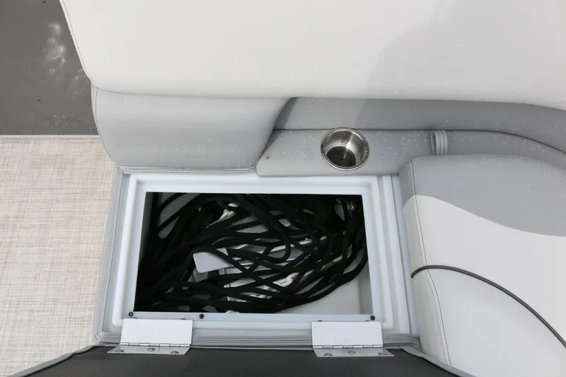 Slide: The Image of Storage compartment on 2025 SunCatcher Select 18C boat with cup holder and seating. - 18