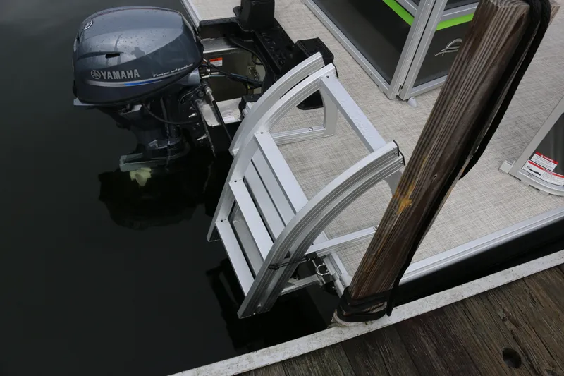 Slide: The Image of Boat motor and ladder on 2025 SunCatcher Select 18C pontoon at dock. - 5