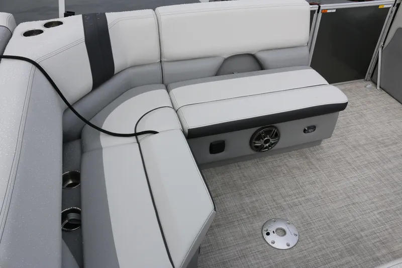 Slide: The Image of Luxurious seating on 2025 SunCatcher Select 18C pontoon boat with integrated speaker system. - 8