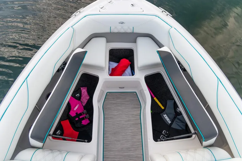 Slide: The Image of 2025 Regal LS4 boat with gray deck, priced at $129,900, featuring forward drive. - 14