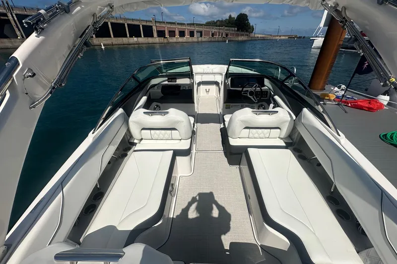 Slide: The Image of Luxurious interior of 2025 Regal LS4 boat with elegant seating and wooden table. - 2