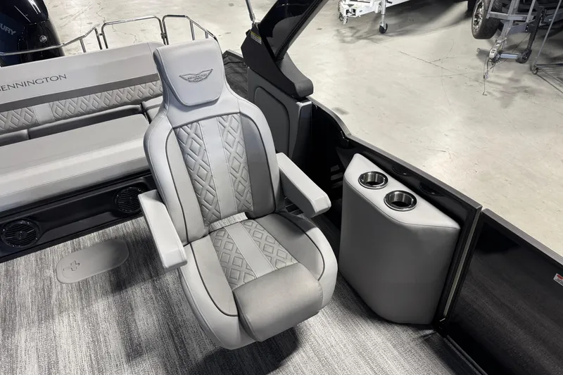 Slide: The Image of Luxury seating on 2026 Bennington 26 MCSB boat with cup holders and stylish design. - 10