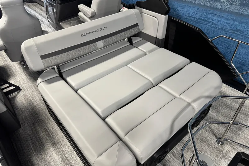 Slide: The Image of 2026 Bennington 26 MCSB boat interior with luxurious gray seating and modern design. - 14