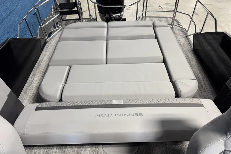 Slide: The Image of 2026 Bennington 26 MCSB boat with luxurious gray seating and sleek design. - 15