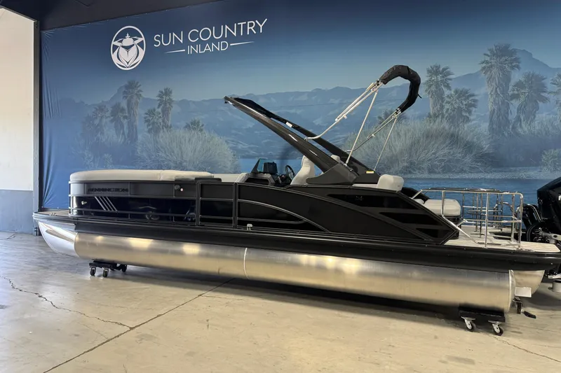 Slide: The Image of 2026 Bennington 26 MCSB pontoon boat displayed at Sun Country Inland showroom. - 3