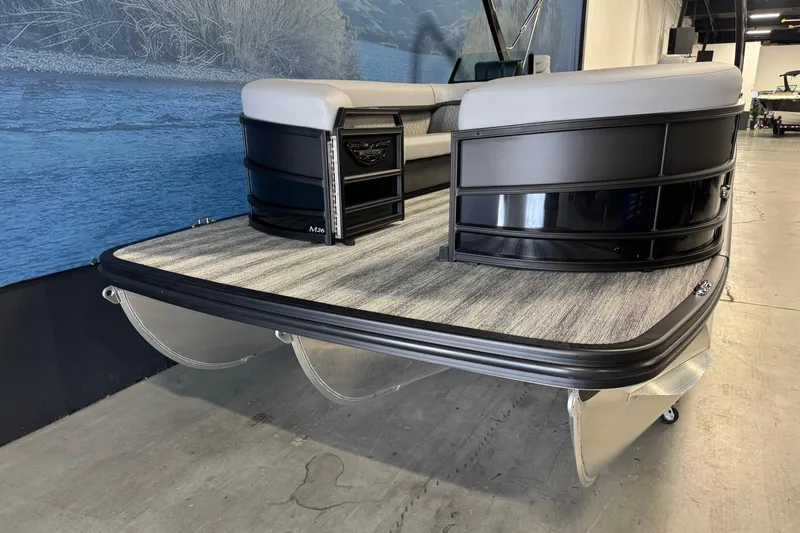 Slide: The Image of 2026 Bennington 26 MCSB pontoon boat with sleek black design and spacious deck. - 5