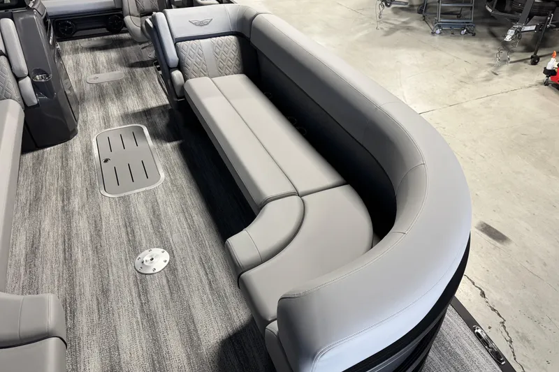 Slide: The Image of Interior of 2026 Bennington 26 MCSB boat with gray seating and flooring. - 8
