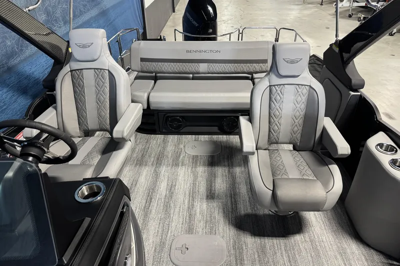Slide: The Image of 2026 Bennington 26 MCSB boat interior with luxurious gray seating and modern design. - 9