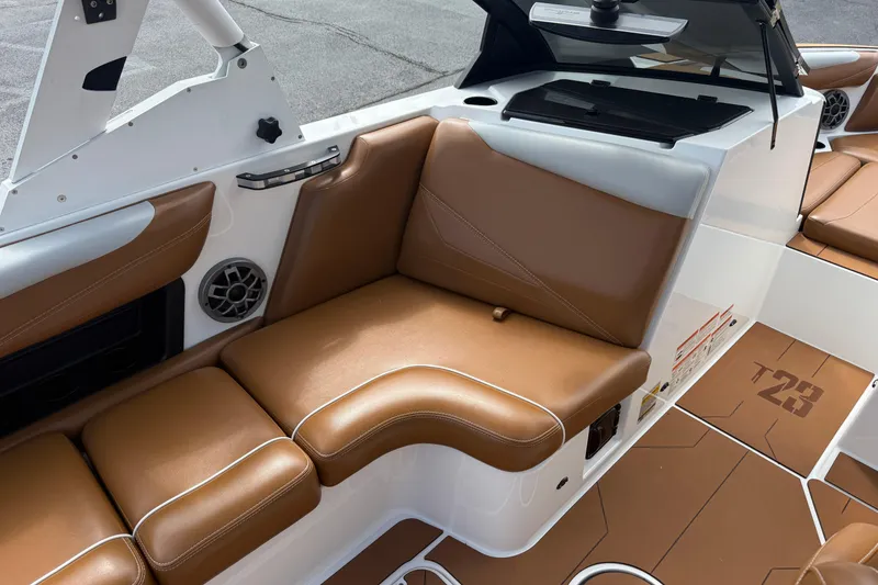 Slide: The Image of 2021 Axis T23 boat interior with brown leather seating and modern design. - 18
