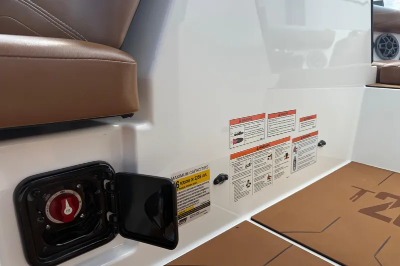 Slide: The Image of 2021 Axis T23 boat interior with safety labels and seating details. - 20