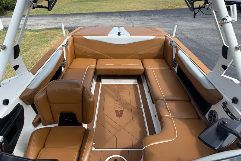 Slide: The Image of 2021 Axis T23 boat interior with tan leather seating and sleek design. - 27