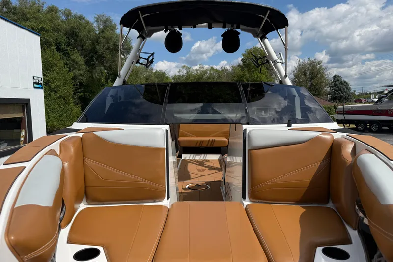 Slide: The Image of 2021 Axis T23 boat interior with tan leather seats and sleek design. - 36