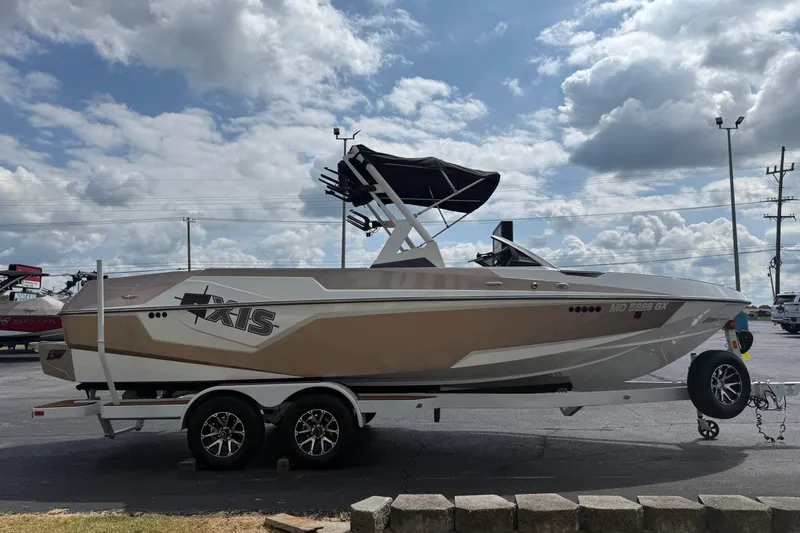 Slide: The Image of 2021 Axis T23 boat on trailer under cloudy sky. - 4