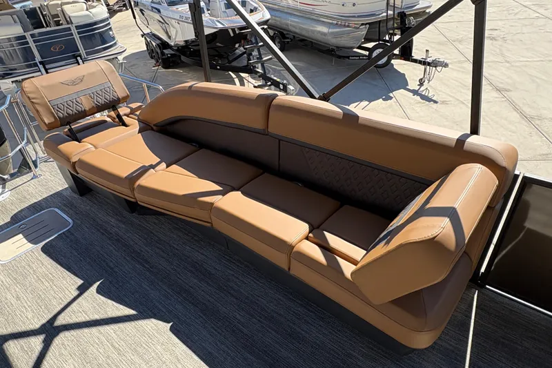 Slide: The Image of Luxurious seating on 2026 Bennington 24 MSL pontoon boat, featuring elegant brown upholstery. - 11