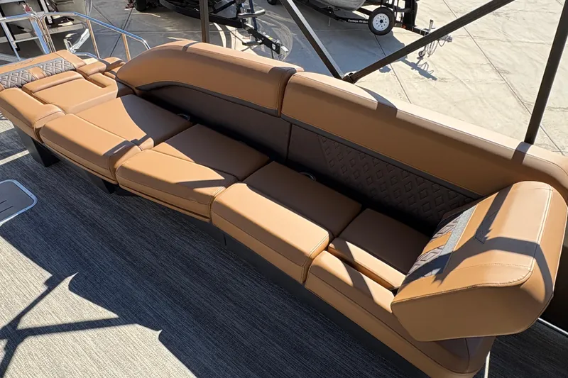 Slide: The Image of Luxurious seating on 2026 Bennington 24 MSL pontoon boat, featuring tan upholstery. - 12