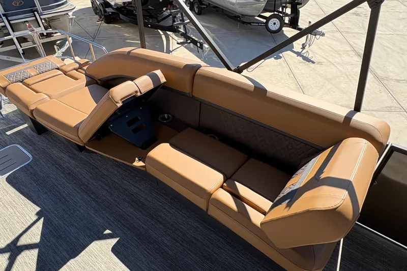 Slide: The Image of Luxurious seating on 2026 Bennington 24 MSL pontoon boat, featuring tan upholstery and modern design. - 13