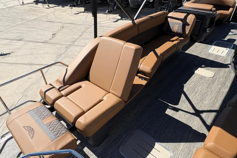Slide: The Image of Luxurious seating on 2026 Bennington 24 MSL boat, featuring tan upholstery and adjustable backrests. - 14