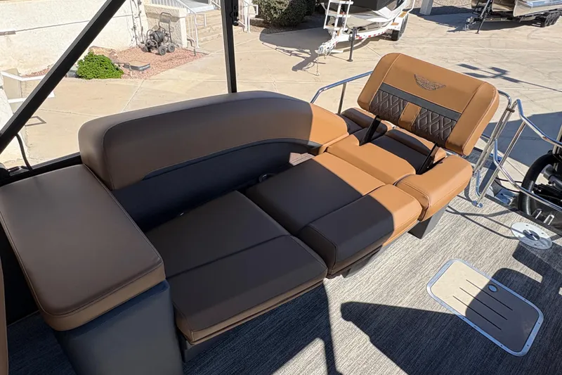 Slide: The Image of Luxurious seating on 2026 Bennington 24 MSL pontoon boat, featuring tan upholstery and spacious layout. - 15