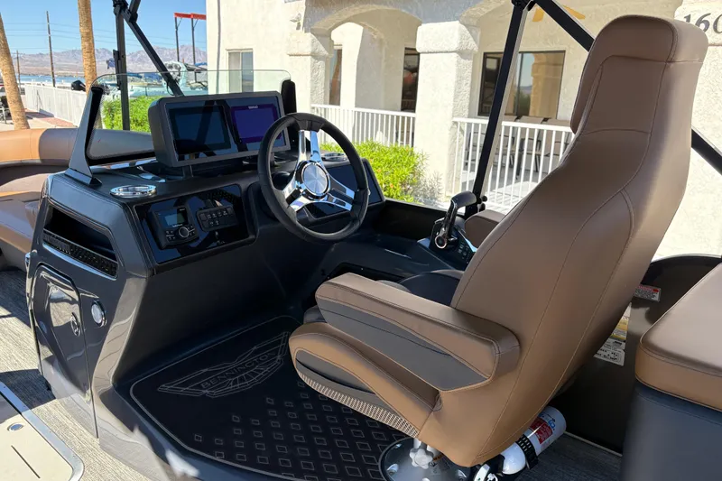 Slide: The Image of 2026 Bennington 24 MSL boat with luxurious tan seating and modern design. - 18