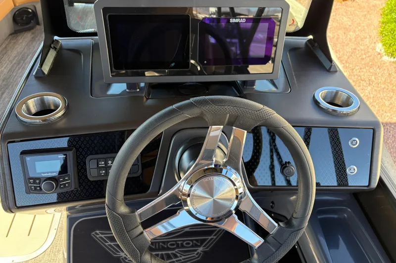 Slide: The Image of Interior of 2026 Bennington 24 MSL boat with modern helm and captain's chair. - 19