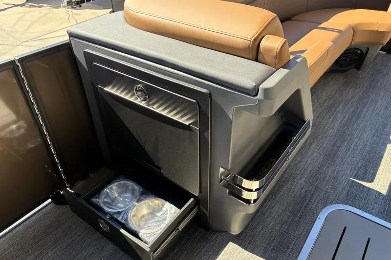 Slide: The Image of 2026 Bennington 24 MSL boat interior with luxurious captain's chair and sleek dashboard design. - 21