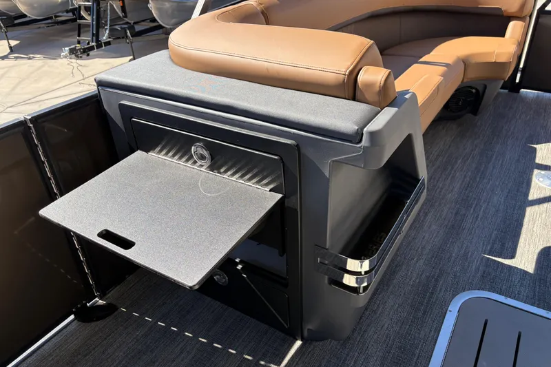 Slide: The Image of 2026 Bennington 24 MSL boat interior with storage compartment and seating. - 22