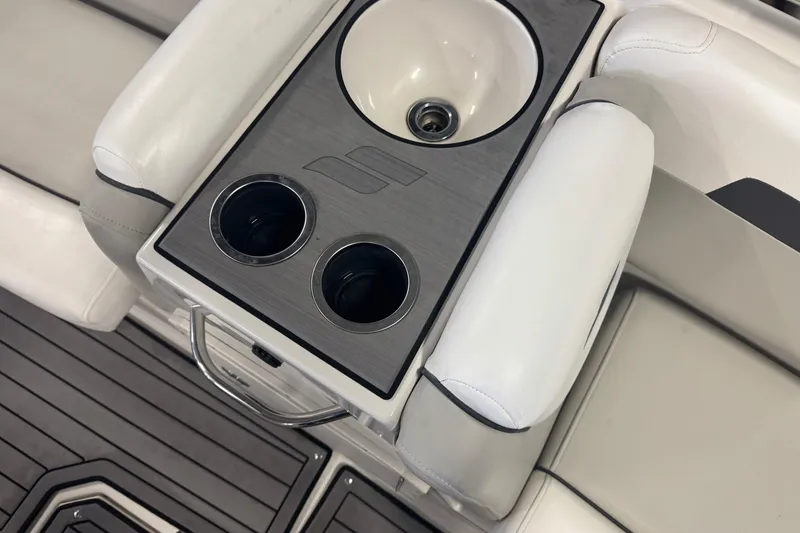 Slide: The Image of 2023 Starcraft SVX 191 OB boat interior with cup holders and sink. - 10
