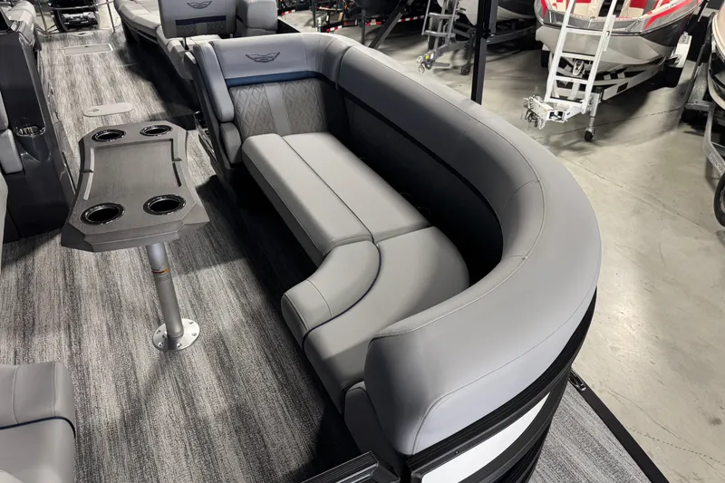 Slide: The Image of 2026 Bennington 24 MSL pontoon boat interior with gray seating and table. - 10