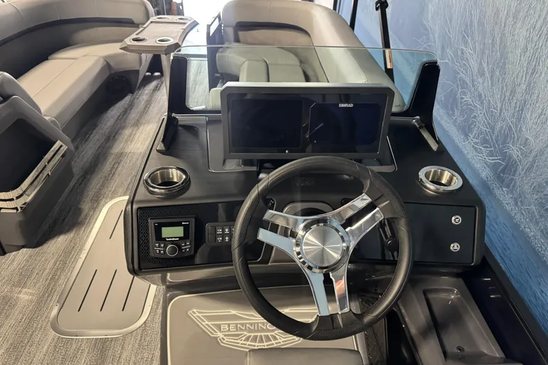 Slide: The Image of 2026 Bennington 24 MSL boat interior with steering wheel and modern dashboard. - 12