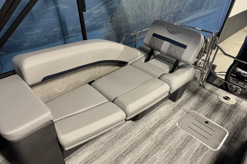 Slide: The Image of 2026 Bennington 24 MSL boat interior with luxurious gray seating and modern design. - 17