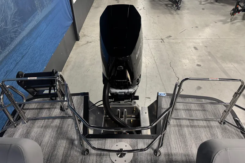 Slide: The Image of 2026 Bennington 24 MSL pontoon boat with Mercury outboard motor, rear view. - 18