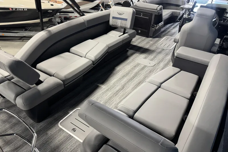 Slide: The Image of Luxurious interior of 2026 Bennington 24 MSL pontoon boat with plush gray seating. - 19
