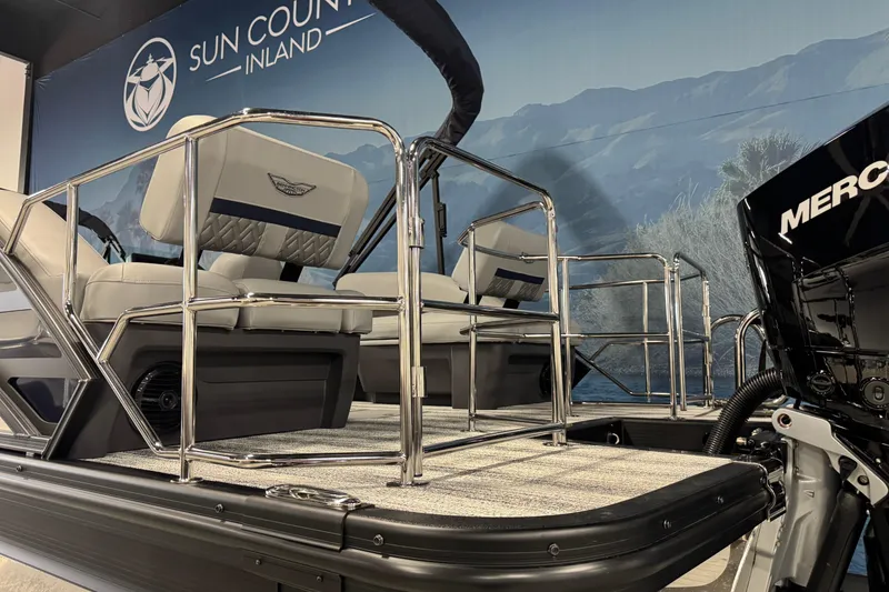 Slide: The Image of 2026 Bennington 24 MSL pontoon boat interior with Mercury engine, displayed at Sun Country Inland. - 6