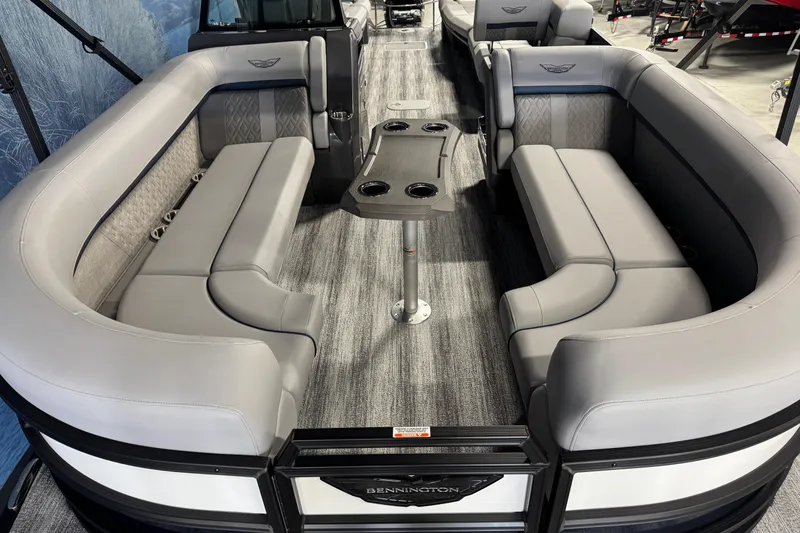 Slide: The Image of 2026 Bennington 24 MSL pontoon boat interior with luxurious seating and table. - 8