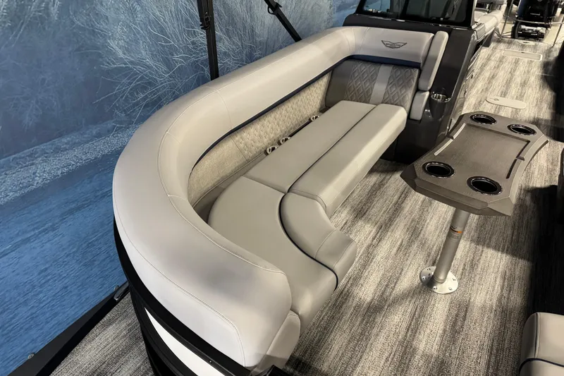 Slide: The Image of Luxurious seating on 2026 Bennington 24 MSL pontoon boat with modern table and cup holders. - 9