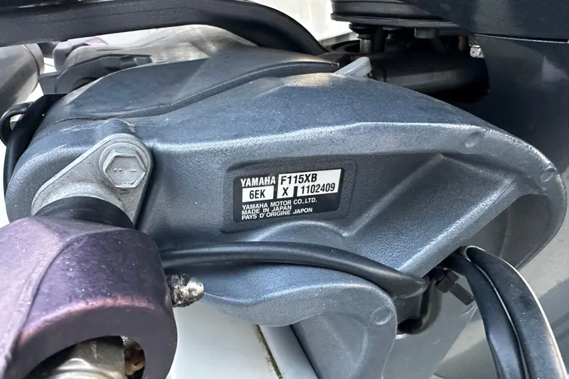 Slide: The Image of Close-up of Yamaha F115XB engine part on 2021 World Cat 230 SD boat. - 105
