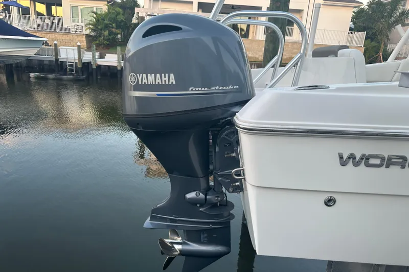 Slide: The Image of 2021 World Cat 230 SD boat with Yamaha four-stroke outboard motor docked by water. - 108