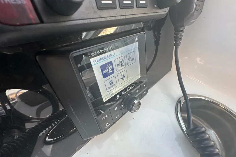 Slide: The Image of JL Audio MediaMaster 50 control panel on 2021 World Cat 230 SD boat. - 23