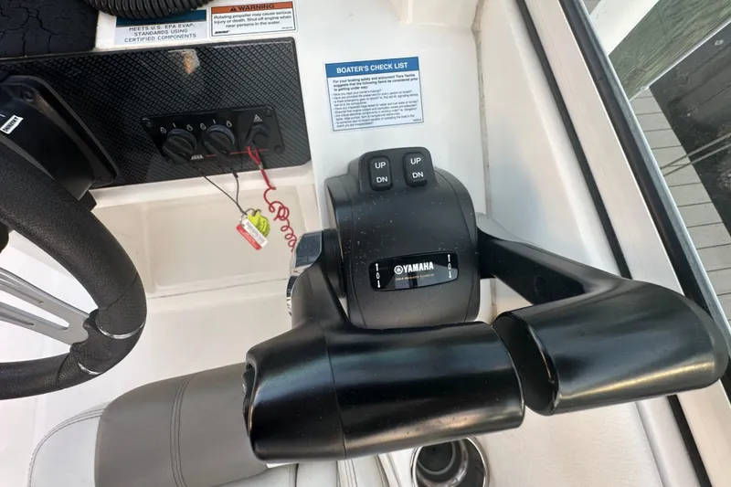 Slide: The Image of Yamaha throttle control on 2021 World Cat 230 SD boat dashboard. - 27