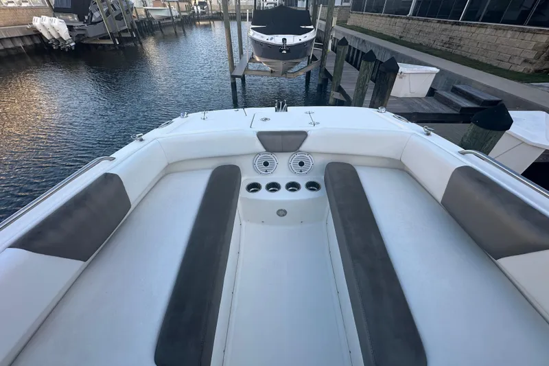 Slide: The Image of 2021 World Cat 230 SD boat interior with cushioned seating and cup holders. - 34