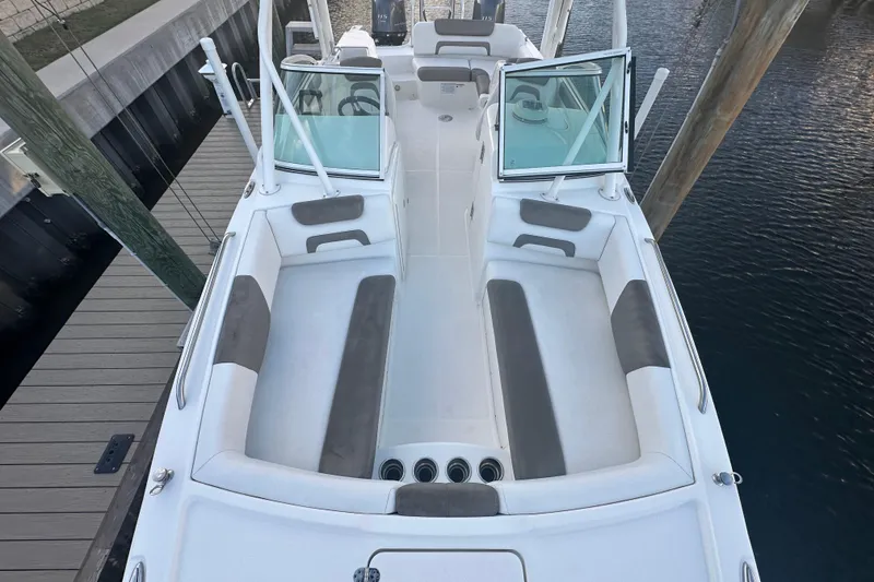 Slide: The Image of 2021 World Cat 230 SD boat interior with spacious seating and open deck design. - 42